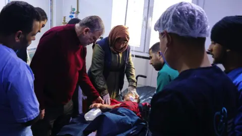 Syrian American Medical Society Mohammed Agid getting treatment at al-Shifa Hospital in Afrin, north-western Syria