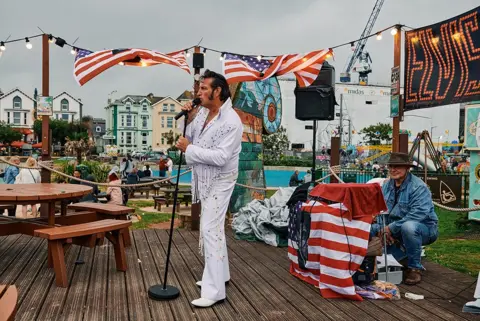 David Hares An Elvis impersonator sings during Elvis week at the Geo Park Cafe in Paignton