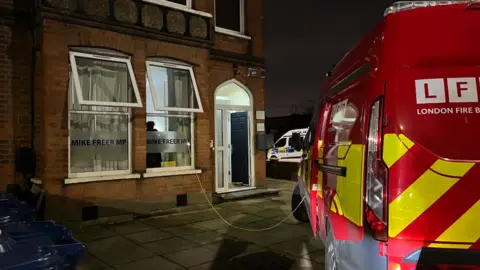 Twitter/@BallardsLane A London Fire Brigade vehicle outside Mike Freer's office