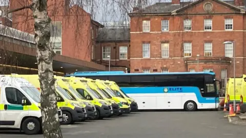 BBC A bus and tent set up as an emergency treatment area outside Leicester Royal Infirmary