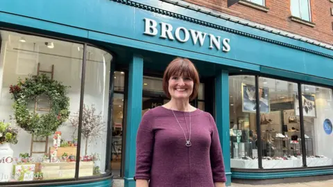 BBC / Naj Modak Lady stood in front of department store