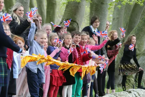 Peter Jolly Northpix gordonstoun children waving union jacks