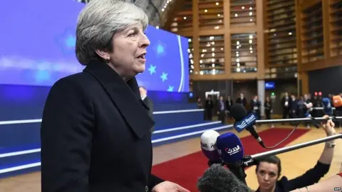 AFP Theresa May speaking to reporters in Brussels