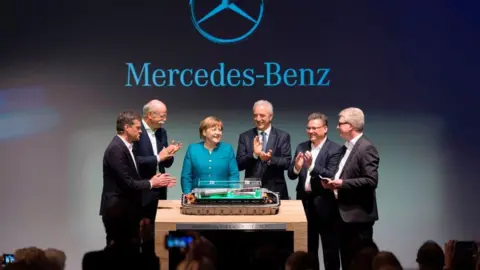 Getty Images Angela Merkel with Mercedes Benz executives