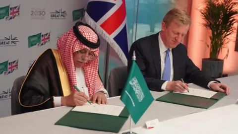 AFP Deputy Prime Minister Oliver Dowden meets with Saudi Arabian minister