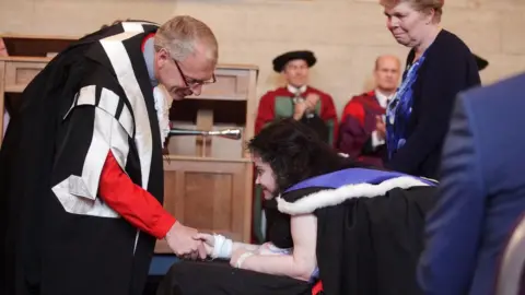 Newcastle University Melanie Hartshorn receives her degree certificate at Newcastle University