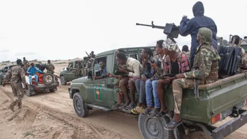 AFP Somali military force members supporting anti-government opposition leaders gather before leaving to their bases in Mogadishu, Somalia, on May 7, 2021