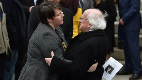 Getty Images Irish President Michael D Higgins consoles Sara Canning, partner of the murdered journalist Lyra McKee