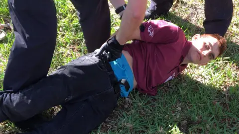 WPTV Nikolas Cruz on ground, being arrested