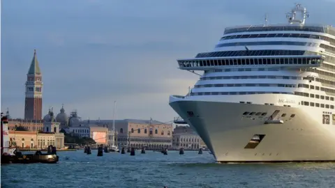 Getty Images A giant cruise ship arrives in front of Saint-Mark's square in Venice on September 21, 2013