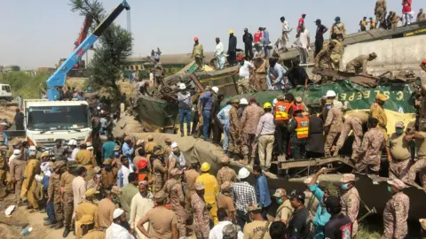 Reuters Rescuers search the wreckage for survivors