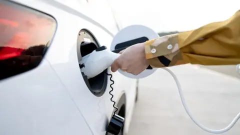 Getty Images Electric car being charged