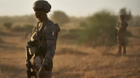 AFP French soldiers monitor a a rural area during an operation in northern Burkina Faso along the border with Mali and Niger - 10 November 2019