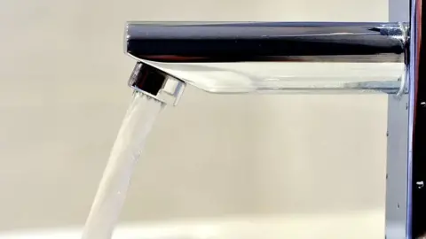 PA A tap with water coming from it