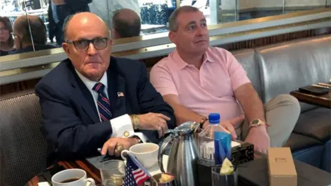 Reuters President Trump"s personal lawyer Rudy Giuliani has coffee with Ukrainian-American businessman Lev Parnas at the Trump International Hotel in Washington