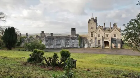 Cliff Day wide shot of the mansion