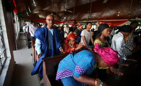 Reuters Worshippers are seen during New Year Mass at the Holy Rosary parish Wuse zone 2, in Abuja, Nigeria January 1, 2019.