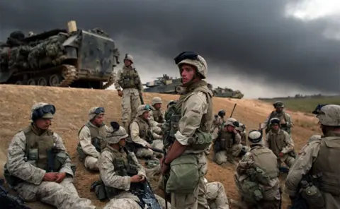 Getty Images US Marines from the 1st Marine Division get set to deploy close to Baghdad, 8 April 2003