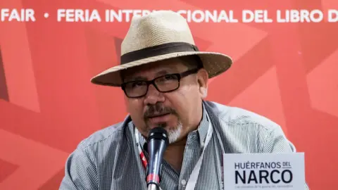 Getty Images A file photo from November 2016 shows Javier Valdez at the launch of his book Huerfanos del narco