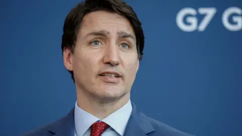 Getty Images Canadian Prime Minister Justin Trudeau attends a press conference with German Chancellor Olaf Scholz (not pictured) after talks at the Chancellery on March 9, 2022 in Berlin, Germany.