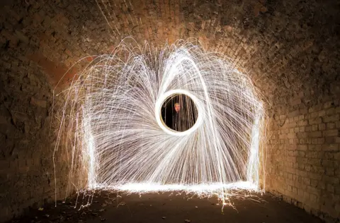 Andrew Neal Steel wool spin under a bridge near Cowdray, Colchester.