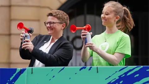 PA Media Leader of Manchester City Council Bev Craig and Freya Lewis (right), start the Great Manchester Run through Manchester city centre, to mark the five-year anniversary of the Manchester Arena bombing