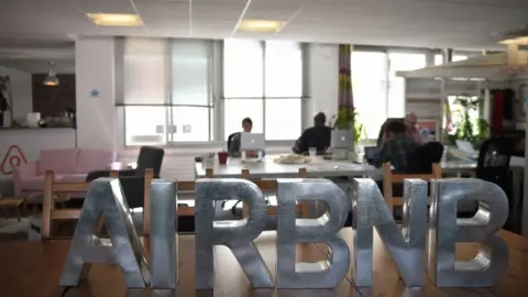 Getty Images Employees at Airbnb's French office