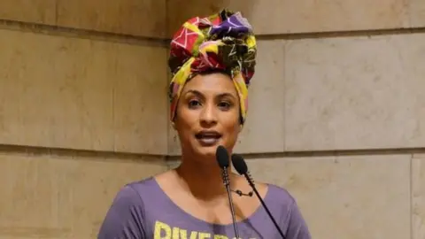 AFP This handout photo released on March 16, 2018, by Rio de Janeiro's Municipal Chamber shows Marielle Franco leading a session at the Municipal Chamber in Rio de Janeiro, Brazil on November 28, 2017.