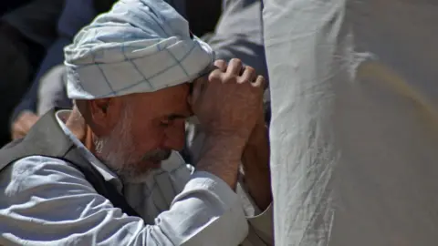 AFP Man at Shia mosque, following the October 2021 attack in Kandahar