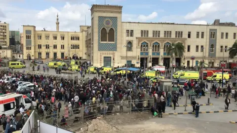 EPA Crowds and ambulances outside Ramses Station, Cairo (27 February 2019)