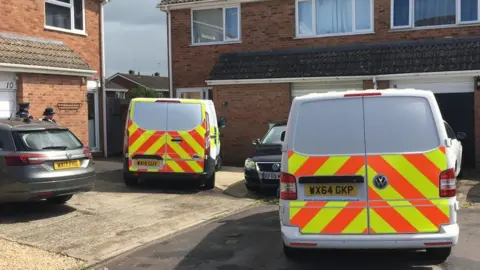 BBC Police vans outside a house in Thames Close