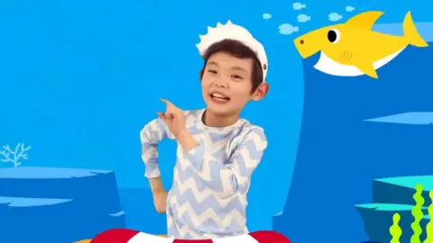 Pinkfong/YouTube A child doing the Baby Shark Dance