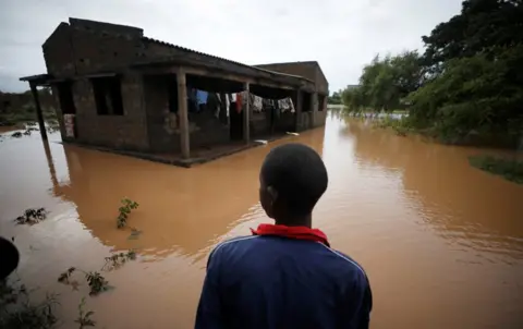 Reuters Agiro Cavanda looks at his flooded home in the aftermath of Cyclone Kenneth, at Wimbe village in Pemba, Mozambique, April 29, 2019