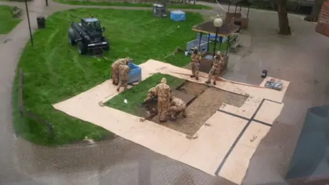 Graham Mulcock Soldiers remove bench