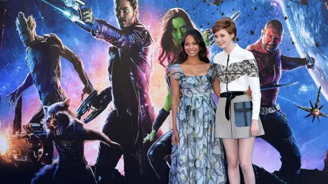 Getty Images Zoe Saldana and Karen Gillan