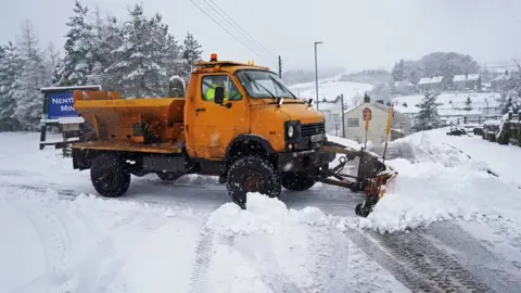 Owen Humphreys/PA A snow plough works on the roads in Nenthead, Cumbria