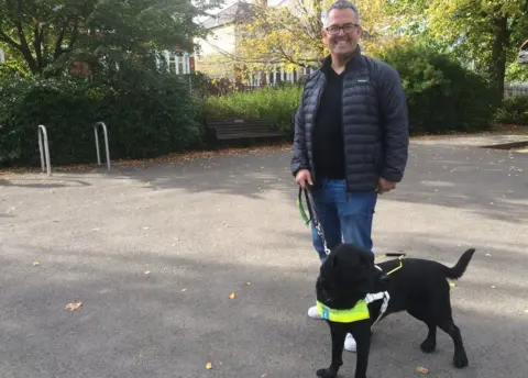 BBC Gareth Davies with his guide dog