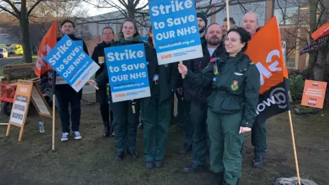 Jamie Coulson/BBC Ambulance workers striking in Leeds