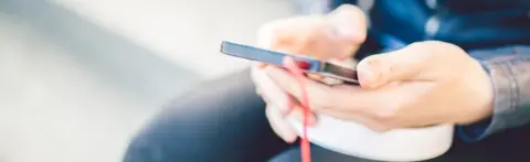 Getty Images A person holding a mobile