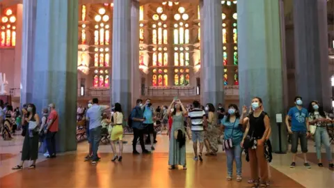 Reuters Healthcare workers and off duty police officers were among those granted access to the Sagrada Familia basilica in Barcelona on Saturday