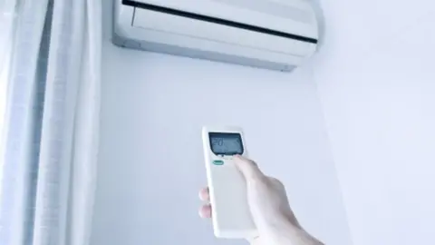 YOKO AZIZ An air conditioning unit