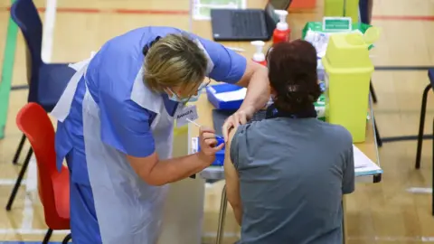 Reuters Vaccination doses being given out in Cwmbran