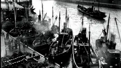 PA Media Herring harvest being landed at Yarmouth Wharf on the Norfolk coast