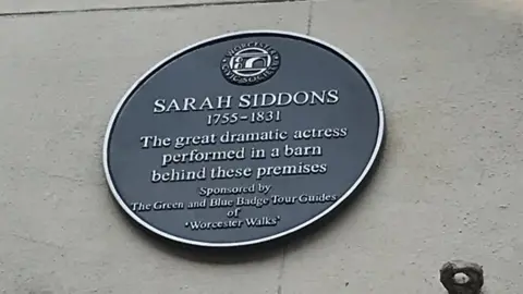 BBC The new blue plaque on the side of a building in Worcester
