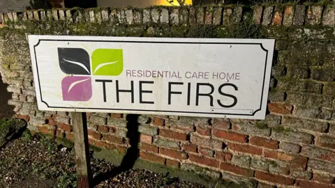 Steve Hubbard/BBC Sign reading The Firs.