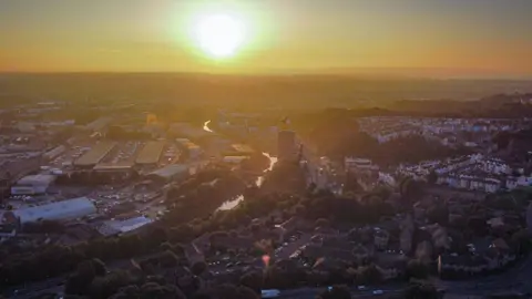 PA Media The sun rises over colourful houses in Totterdown, Bristol, on 5 September 2023