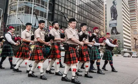 AFP South African pipers marching in Durban, South Africa - Sunday 11 November 2018