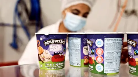 Reuters Tubs of Ben & Jerry's ice cream are seen at a factory in Be'er Tuvia, Israel (20 July 2021)