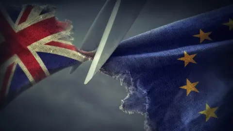 Getty Images British and EU flags are cut