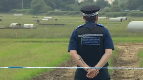 Officer at cordon of Goodwood air crash